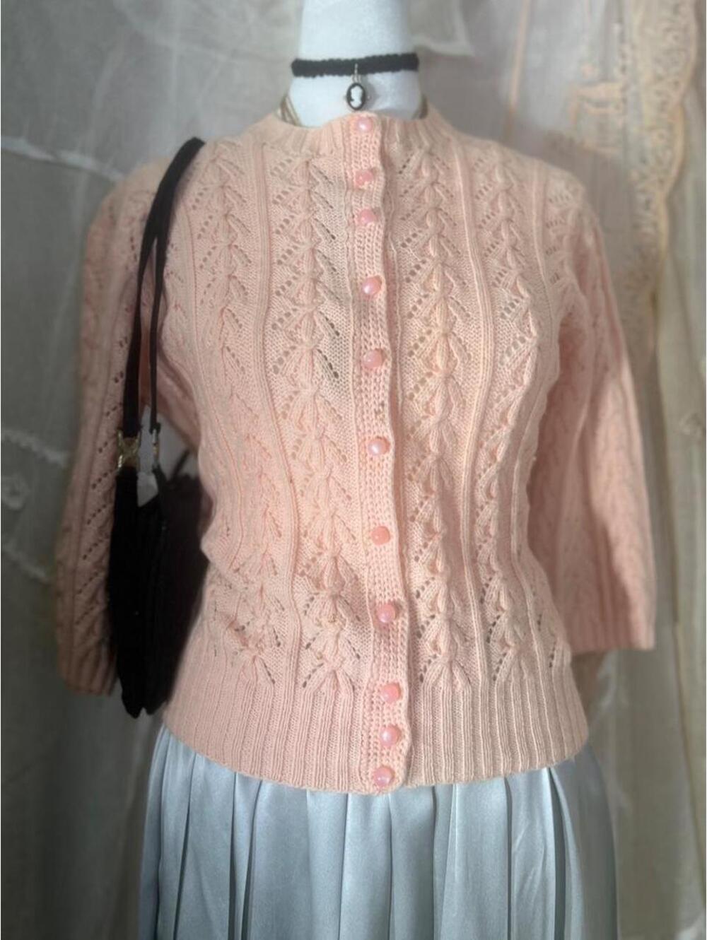 Vintage 1950s pink cable knit cardigan with pearl buttons